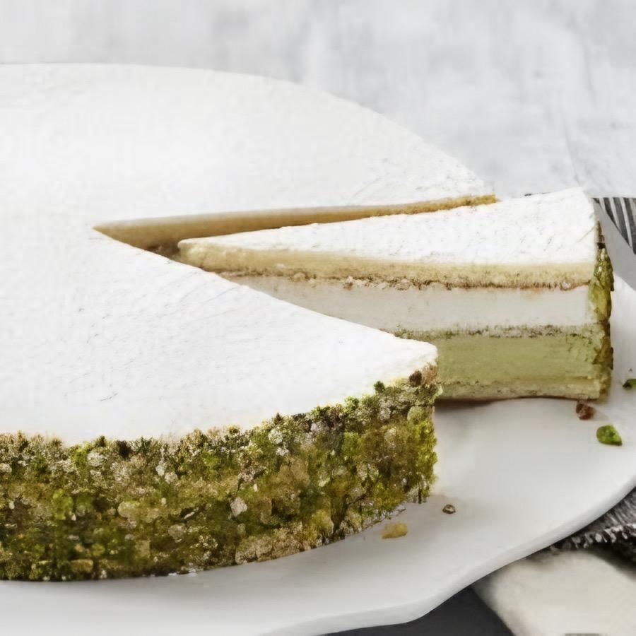 Ricotta & Pistachio Cake  Pistachio and ricotta creams separated by sponge cake, decorated with crushed pistachios and dusted with powdered sugar. Weight: 2 lbs. 6.8 oz.  Suggested servings: 12 pre-cut servings